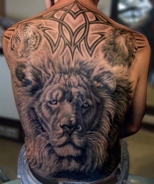 Grey Ink Tribal And Lion Head Animal Tattoo On Back