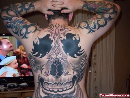 Grey Ink Tribal And Skull Animated Tattoo On Back