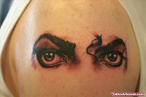 Grey Ink Animated Girl Eyes Tattoo On Shoulder