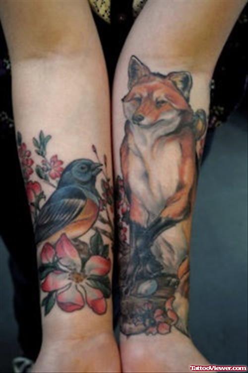Flower And Bird Animated Fox Tattoos On Forearm