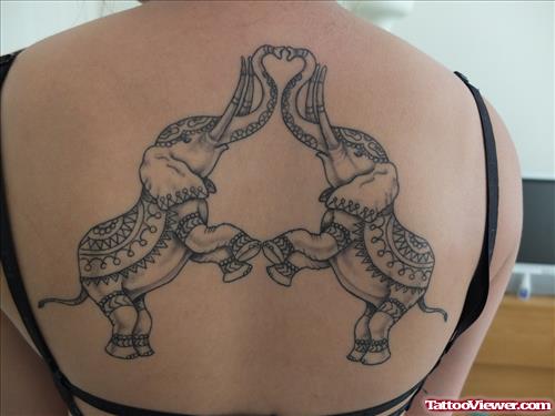 Grey Ink Two Animated Elephants Tattoos On Back