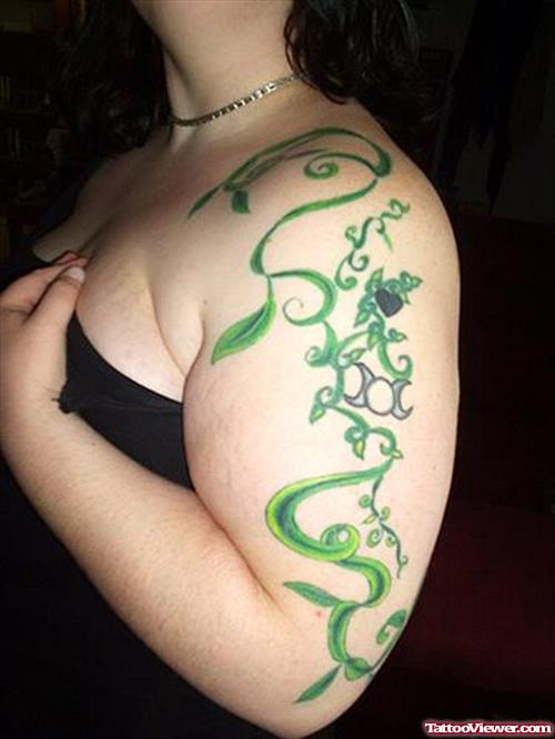 Green Ink Animated Tattoo On Left Half Sleeve