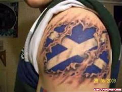 Ripped Skin Animated Flag Tattoo On Left Shoulder