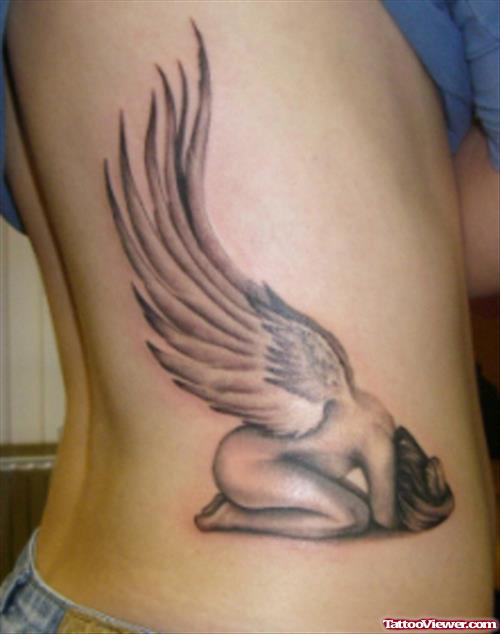 Grey Ink Winged Angel Animated Tattoo On Side Rib
