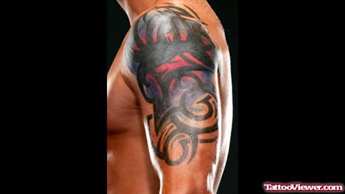 Color and Tribal Animated Tattoo On Half Sleeve