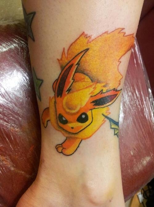 Yellow Ink Animated Tattoo On Leg