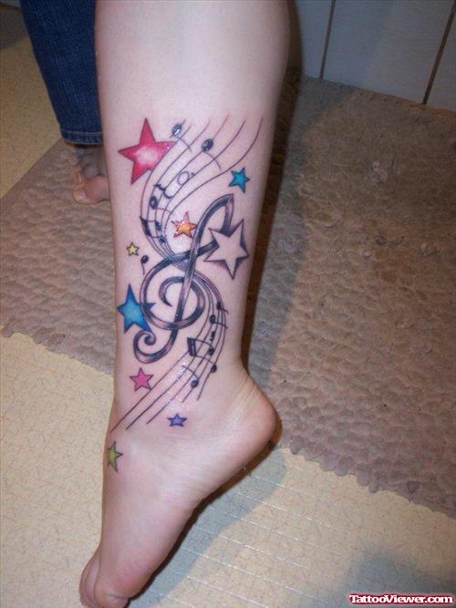 Colored Stars And Music Notes Tattoo On Ankle