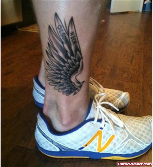 Grey Ink Sngel Wing Ankle Tattoo