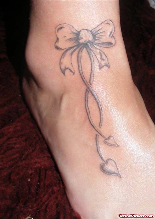 Grey Ink Bow Ankle Tattoo