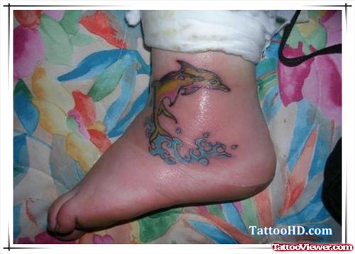 Jumping Dolphin Tattoo On Left Ankle