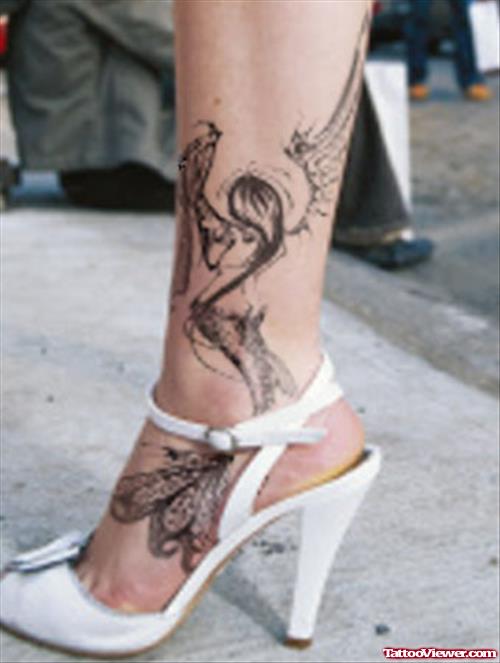 Grey Ink Tribal Fairy Ankle Tattoo