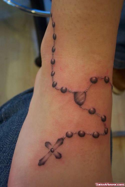 Grey Ink Rosary Ankle Tattoo On Right Foot