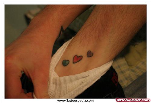 Tiny Colored Hearts Ankle Tattoo