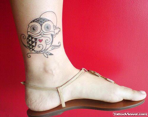 Grey Ink Owl Tattoo On Left Ankle