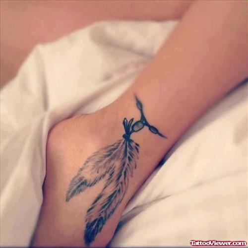 Flying Bird And Feather Ankle Tattoo