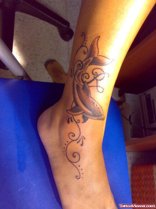 Grey Ink Dolphin Ankle Tattoo
