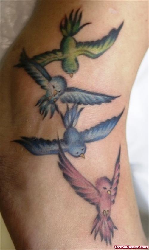 colored Flying Birds Ankle Tattoo