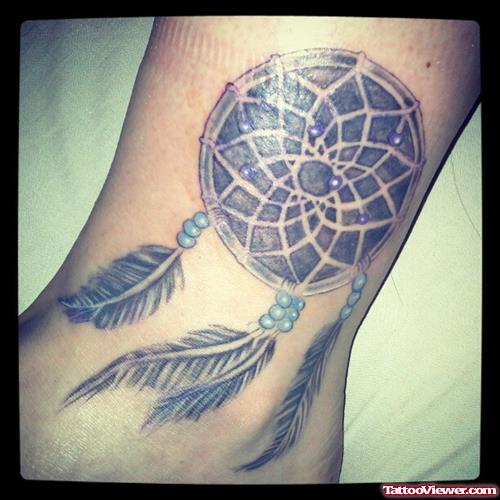 Grey Ink Dreamcatcher Tattoo On Ankle