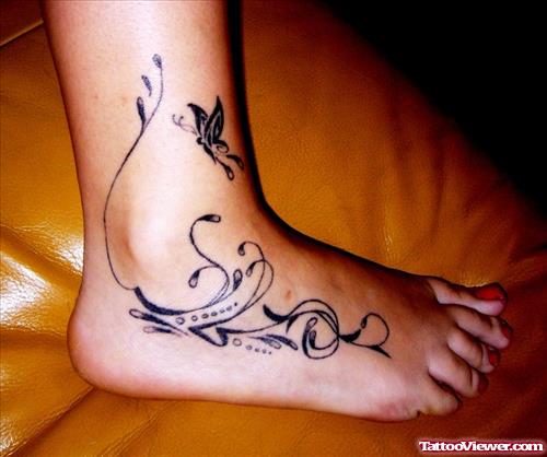 Grey Ink Flying Butterfly and Swirl Ankle Tattoo On Right Foot