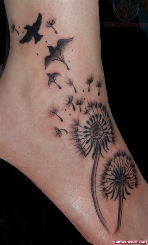 Grey Ink Flying Birds And Dandelion Puff Ankle Tattoo