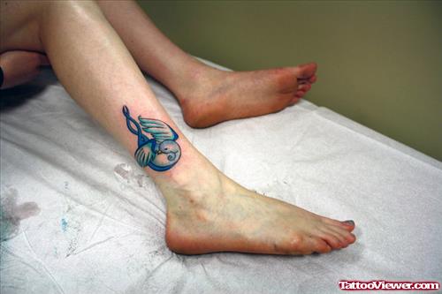 Blue Ink Swallow Ankle Tattoo