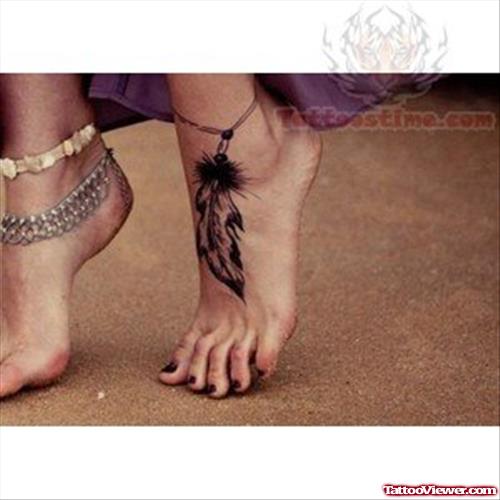 Black Feather Tattoo On Girl Left Ankle