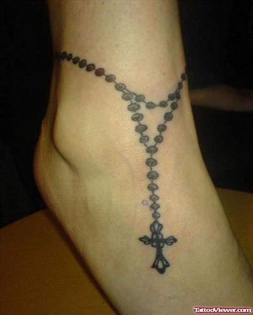Attractive Grey Ink Cross Tattoo On Right Ankle