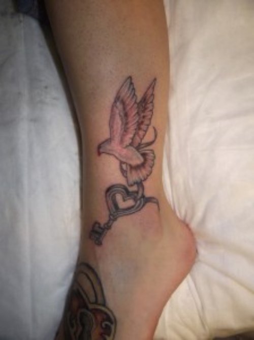 Key and flying Bird Ankle Tattoo