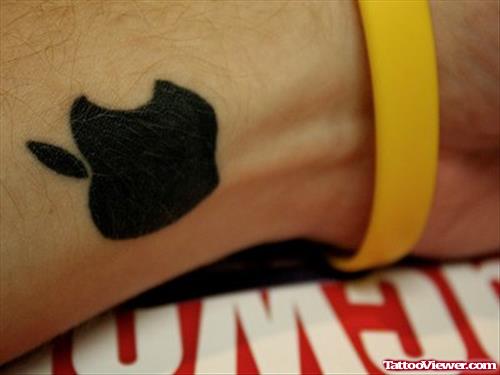 Attractive Black Apple Logo Tattoo On Wrist