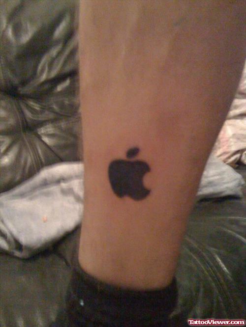 Black Ink Apple Logo Tattoo On Ankle