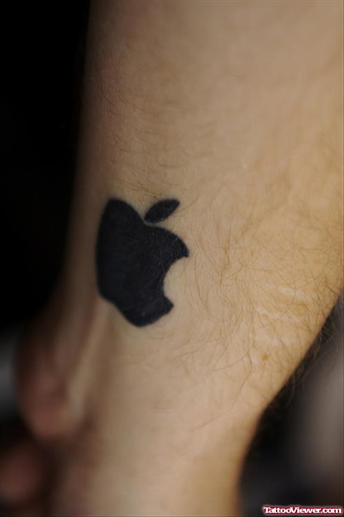 Black Apple Logo Tattoo On Wrist