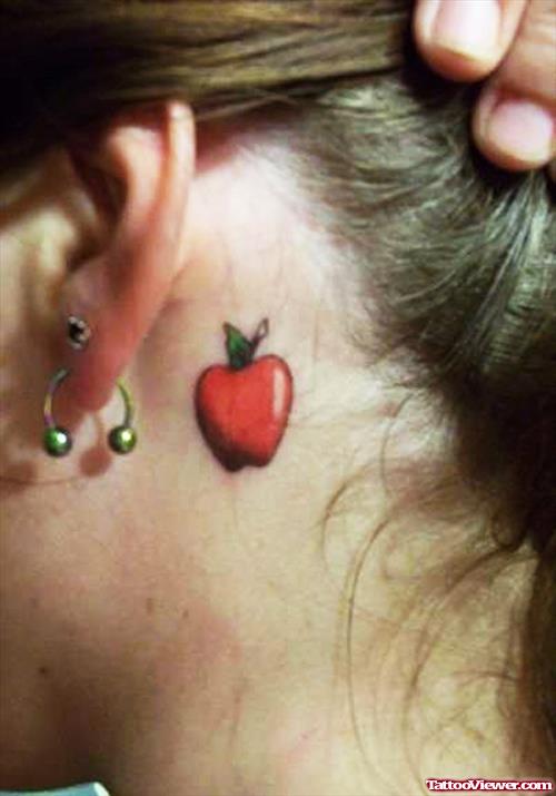 Red Apple Tattoo Behind Girl Ear