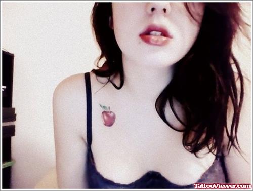 Red Ink Small Apple Tattoo On Collarbone