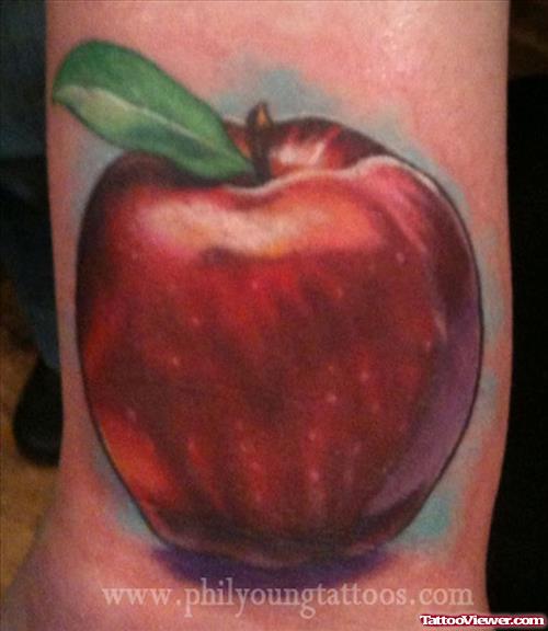 Red Ink Apple Tattoo On Wrist