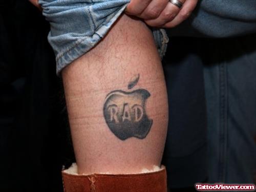Grey Ink Apple Tattoo On Leg