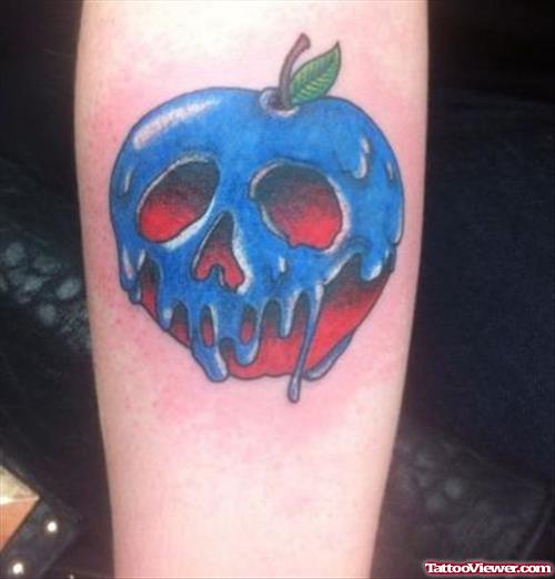 Blue Ink Rotten Apple Tattoo On Arm