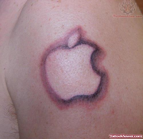 Grey Ink Apple Logo Tattoo On Left Shoulder