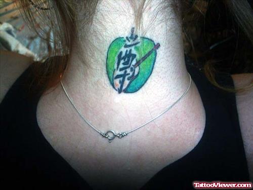 Green Ink Apple Tattoo On Nape