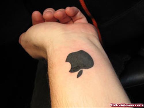 Black Ink Apple Tattoo On Left Wrist