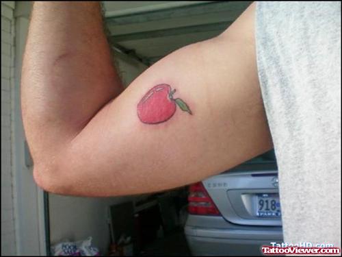 Red Ink Apple Tattoo On Bicep