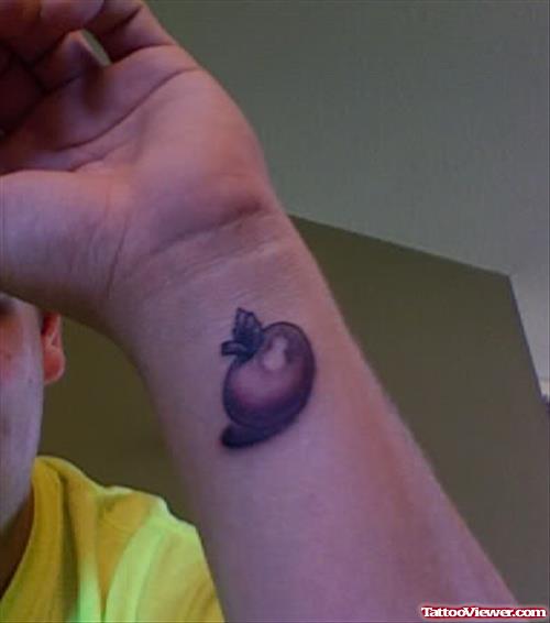 Grey Ink Apple Tattoo On Wrist