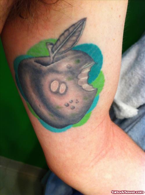 Grey Ink Apple Tattoo On Inner Bicep