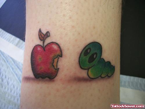 Green Insect and Red Apple Tattoo