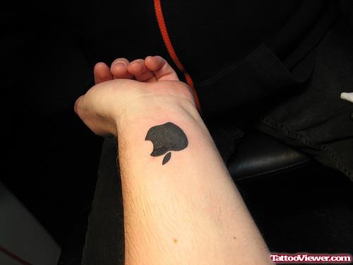 Awesome Black Ink Apple Tattoo On Left Wrist
