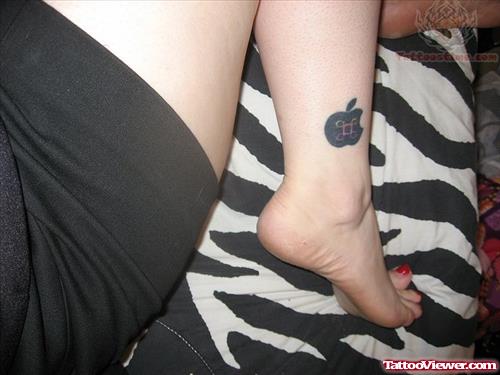 Apple Tattoo On Girl Leg