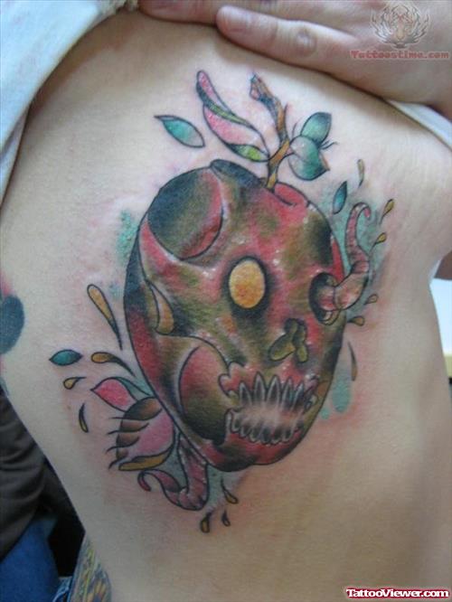 Skull Apple Tattoo On Rib
