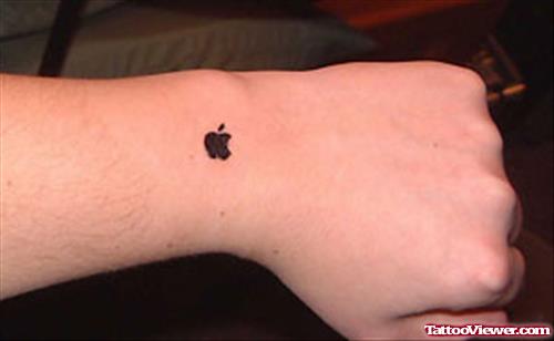 Small Balck Apple Logo Tattoo On Wrist