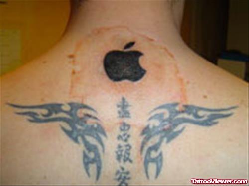 Apple Logo And Tribal Tattoo On Back