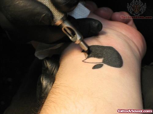 Filling Black Ink In Apple Tattoo