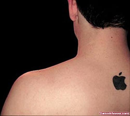 Black Apple Tattoo On Upper Back